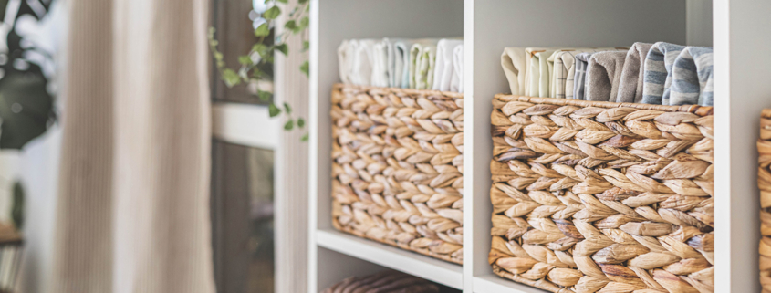 Domestic textile bed linen neatly placed cupboard shelves minimalism Nordic storage method closet organization